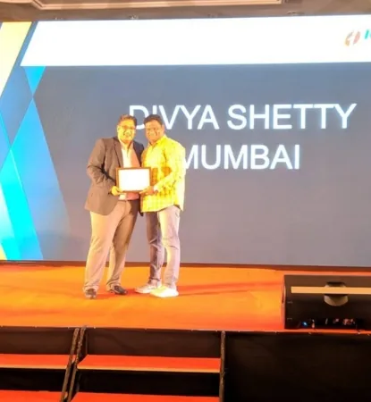 A Wise Insurance representative receiving the Highest Health Insurance Business Award on stage at an ICICI Lombard recognition event