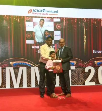 A Wise Insurance representative receiving the Platinum Agent Award on stage at an ICICI Lombard summit in Singapore