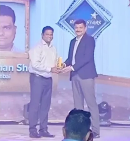 A Wise Insurance representative receiving the Rising Star Agent Award on stage at a Reliance General Insurance event in Amritsar