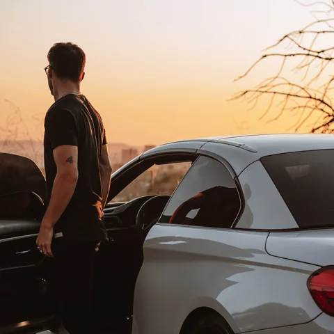 A car owner with their vehicle