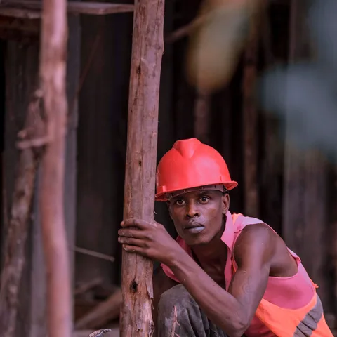 A construction contractor on-site wearing a hard hat