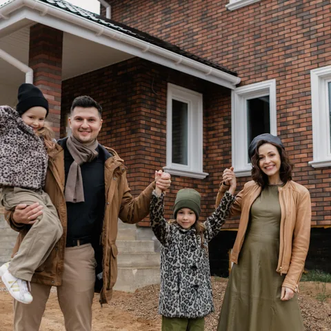 A family in front of their home