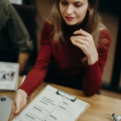 An HR professional reviewing employee records