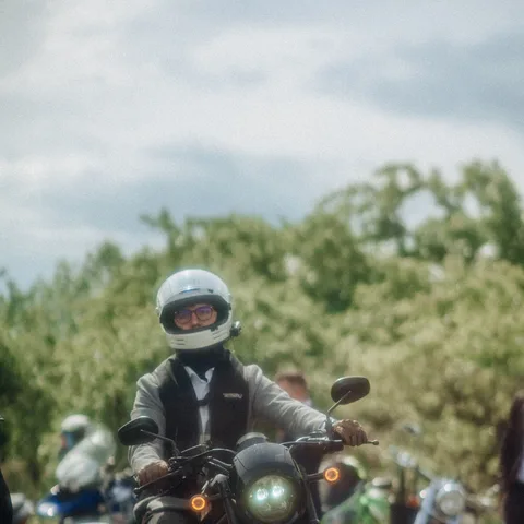 A two-wheeler rider with their motorcycle