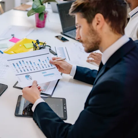 Professionals reviewing risk assessment reports